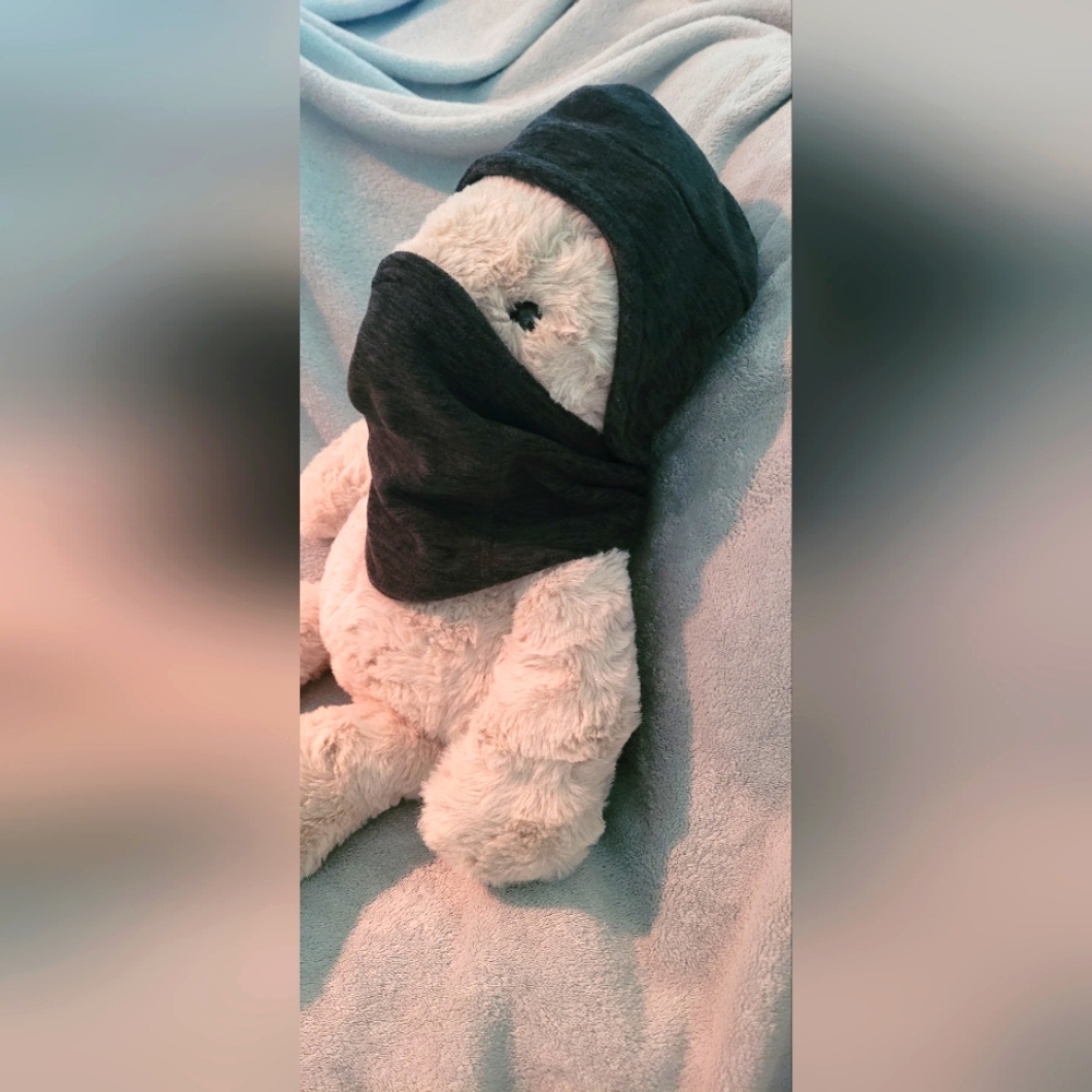 Kids dark gray fleece like hat & neck warmer that snaps together.